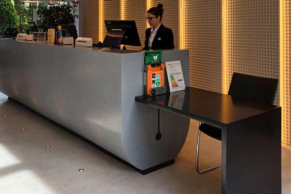 Double-height reception desk.